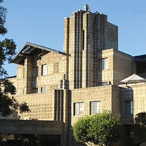 A photograph of a building against a blue sky